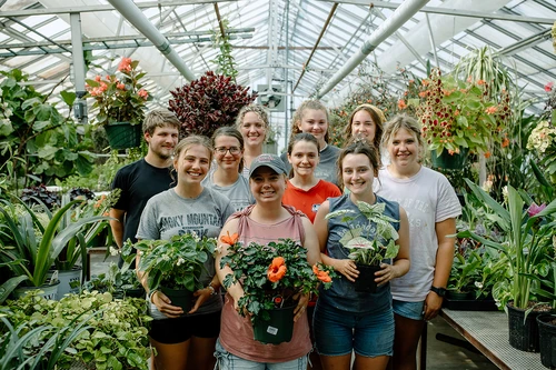 Students standing in the Greenhouse.